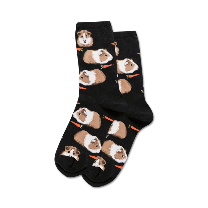 Pair of black crew socks with a repeating pattern of brown and white guinea pigs and orange carrots. }}