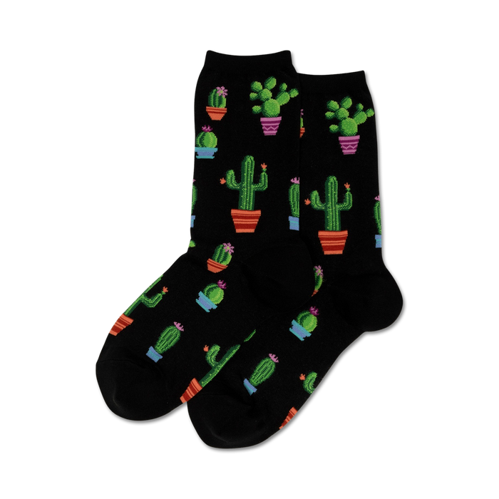 Pair of crew socks in black with a repeating pattern of potted cacti in various colors and sizes.