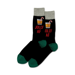 Pair of black crew socks with a green cuff.  Features a red 'Jolly AF' slogan and a cocktail graphic with a candy cane.