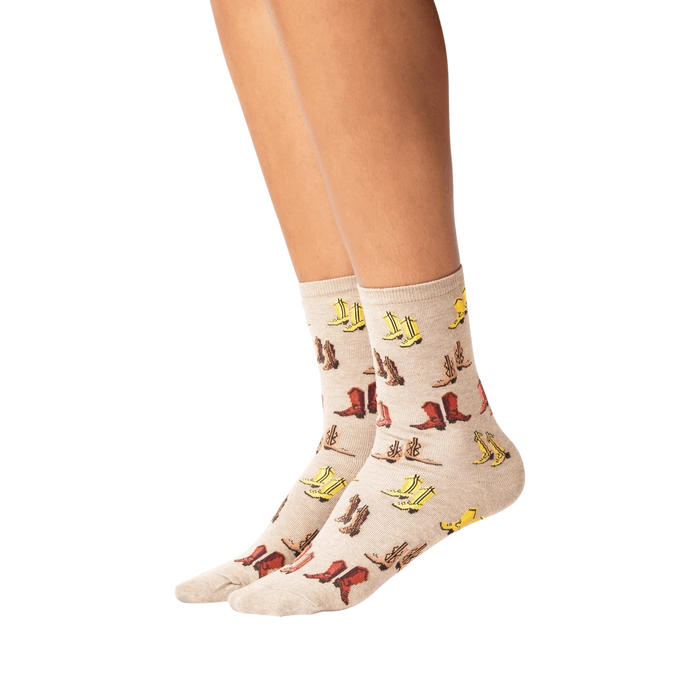 Lifestyle shot showing the socks on a person's legs. The socks are beige with a colorful cowboy boot print.