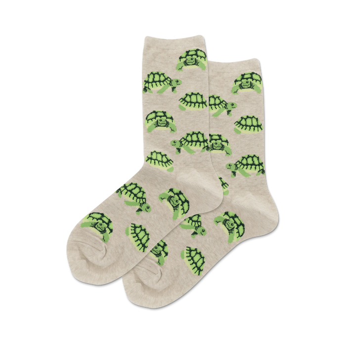 Pair of tan crew socks with a repeating pattern of cute green turtles. }}