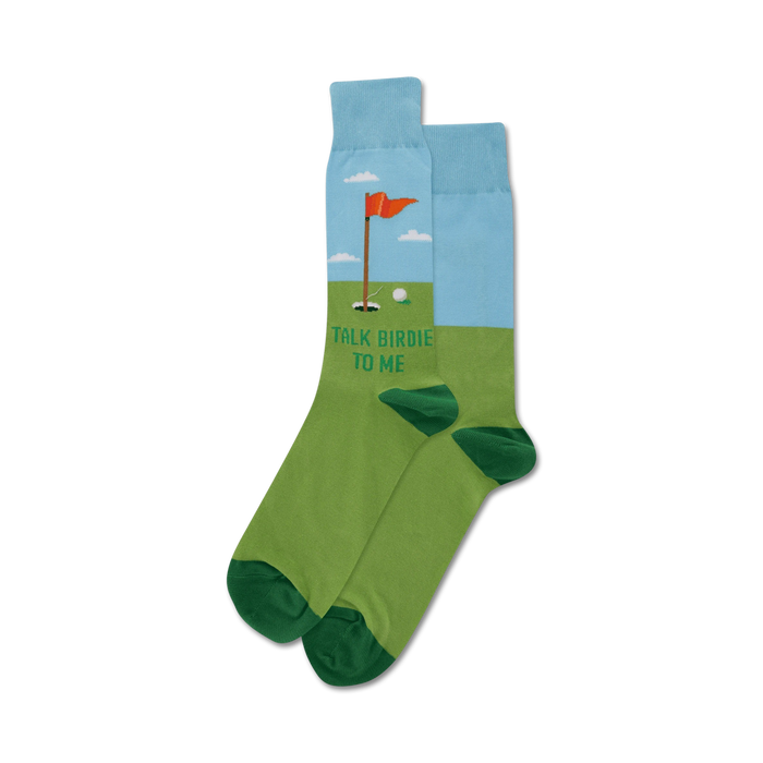 A pair of crew socks in green, blue, and white featuring a golf-themed design with a flag, golf ball, and the text 'Talk Birdie To Me'. }}