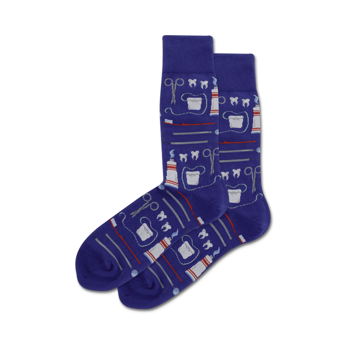 Pair of purple crew socks with a whimsical dental design. The pattern includes toothbrushes, toothpaste, dental floss, and other dental tools. }}