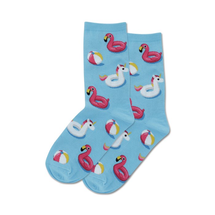 Pair of crew socks in light blue, featuring pink flamingo and unicorn pool floats and yellow beach balls.