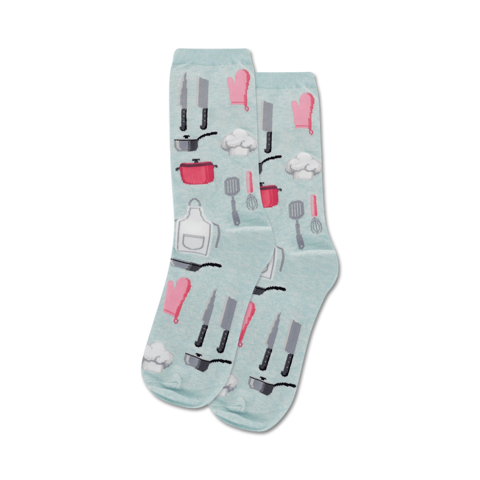 Pair of light blue crew socks with a fun pattern of kitchen utensils in pink and gray. Designs include knives, whisks, pots, and chef hats. }}