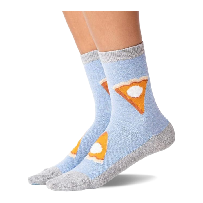 Pair of light blue crew slipper socks with gray heel, toe, and cuff, featuring pie slices with whipped cream, worn on feet.