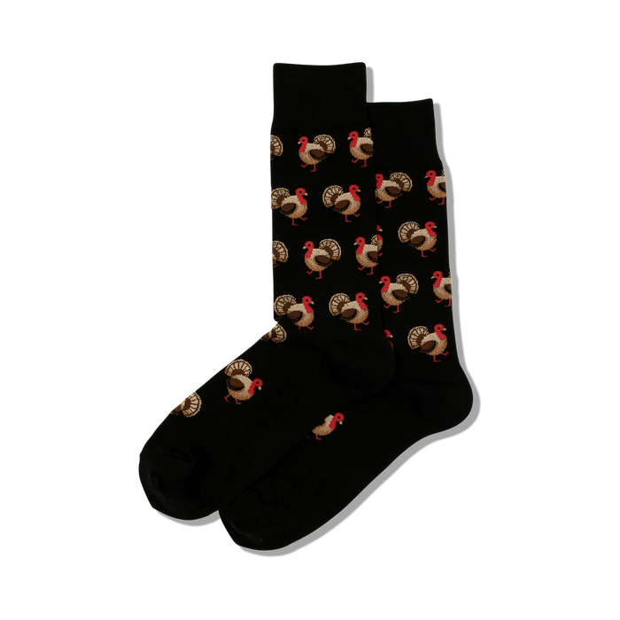 Pair of black crew socks with a repeating pattern of brown and red turkeys. Fun and festive! }}