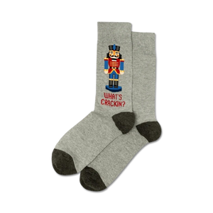 Pair of gray crew socks with a pixelated Nutcracker design and the text 'What's Crackin?' in red.  Dark gray heel and toe.