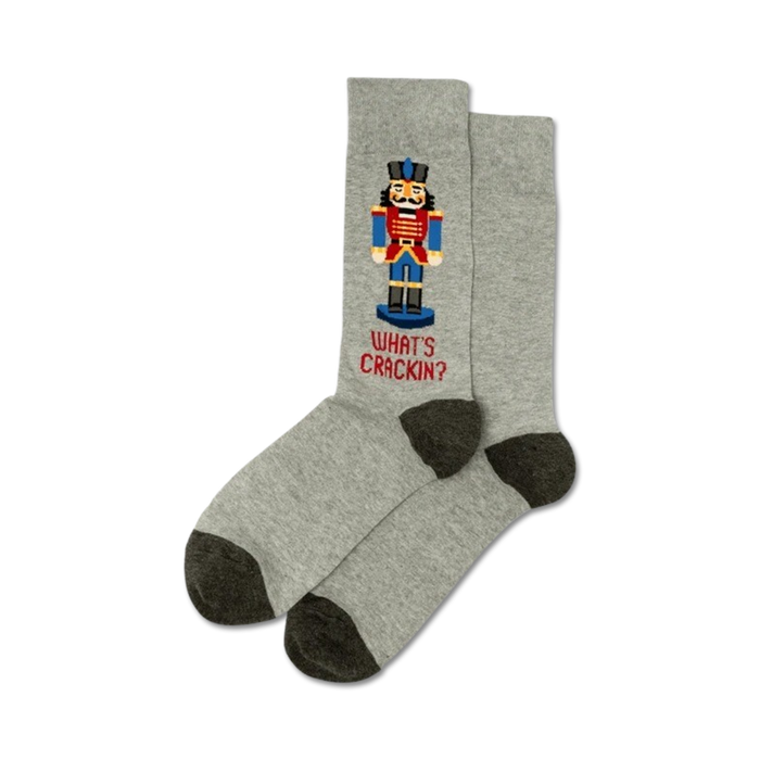 Pair of gray crew socks with a pixelated Nutcracker design and the text 'What's Crackin?' in red.  Dark gray heel and toe.