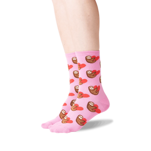 Lifestyle shot: Person wearing pink sloth socks, showcasing the fit and design.