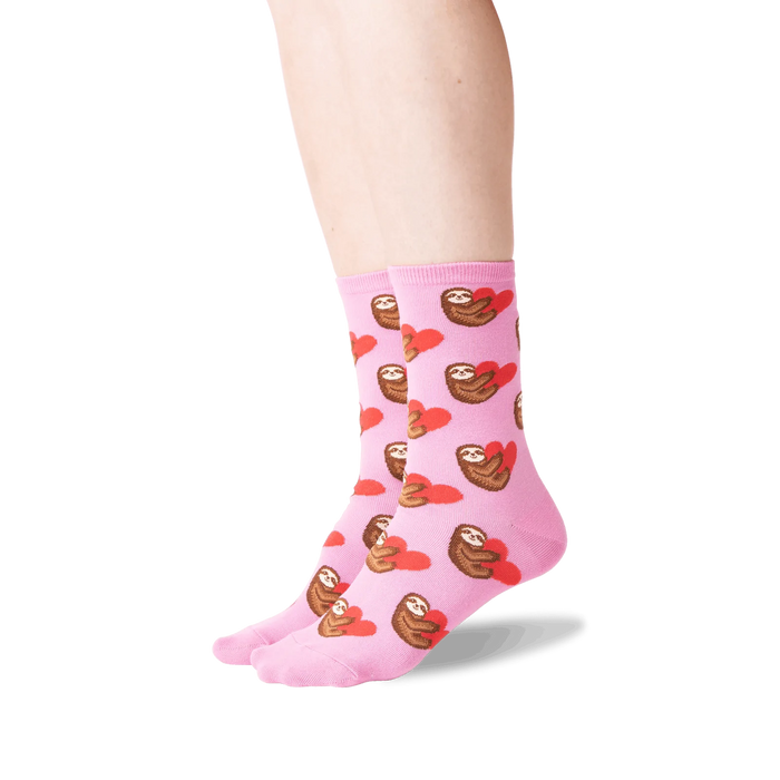 Lifestyle shot: Person wearing pink sloth socks, showcasing the fit and design.
