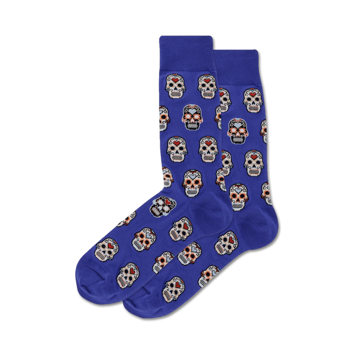 Pair of purple crew socks with a repeating pattern of colorful sugar skull designs.  }}