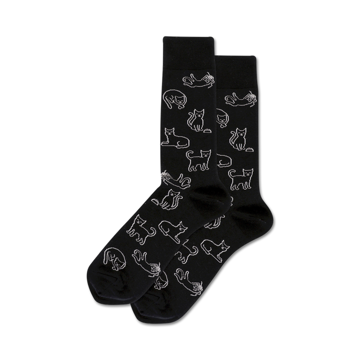Pair of black crew socks with a repeating pattern of white cat outlines in various poses.  A fun and quirky design! }}