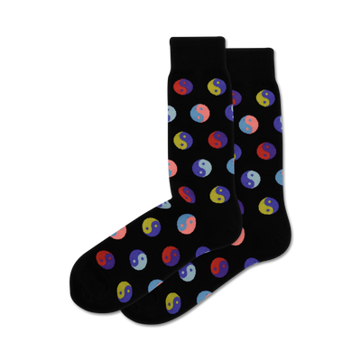 Pair of black crew socks with a repeating pattern of multicolored Yin Yang symbols.