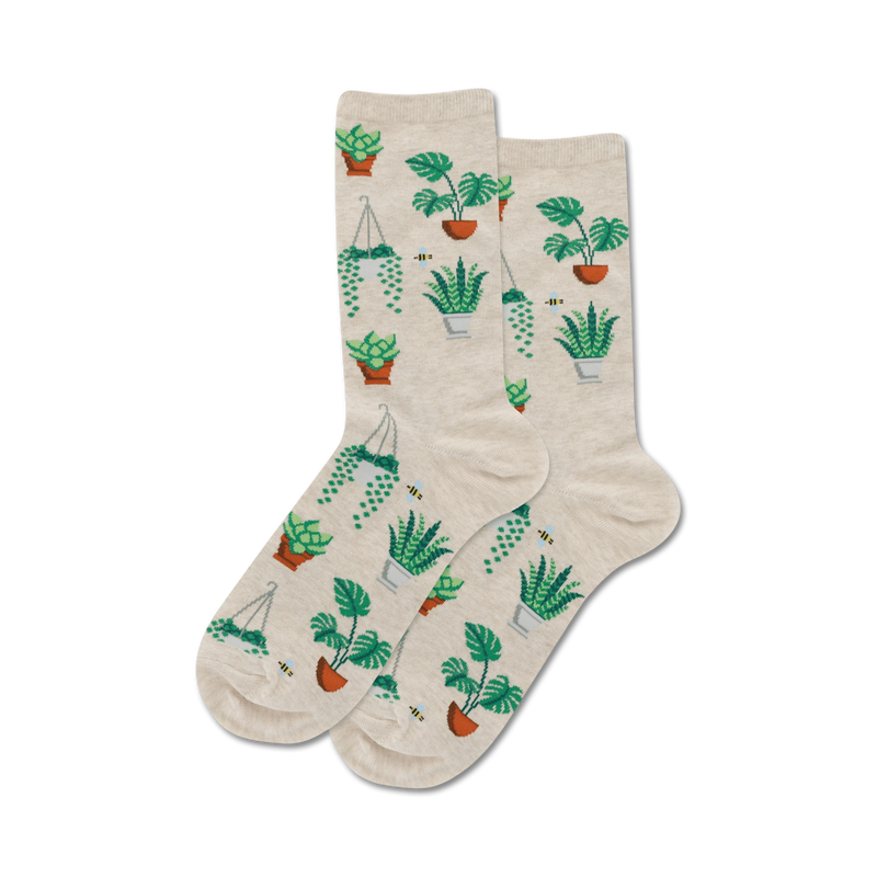 Pair of beige crew socks with a pattern of various green potted plants and small bees.