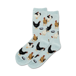 Lifestyle shot of a person's feet wearing the light blue 'Feeding Chickens' socks.