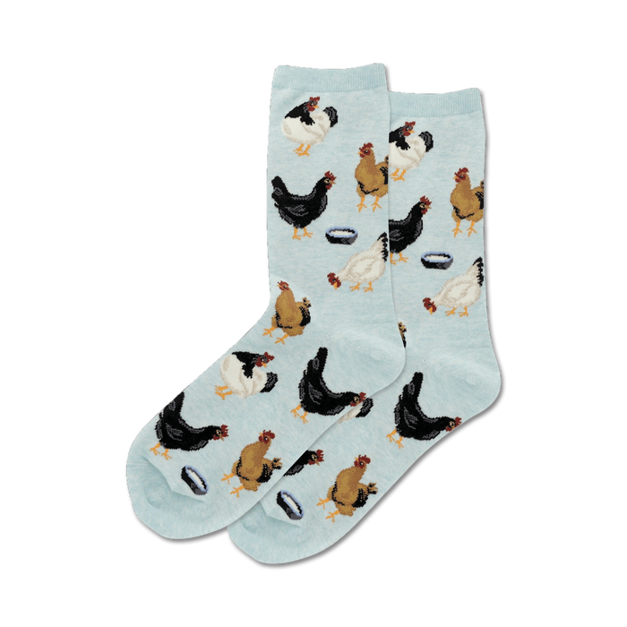 Lifestyle shot of a person's feet wearing the light blue 'Feeding Chickens' socks.