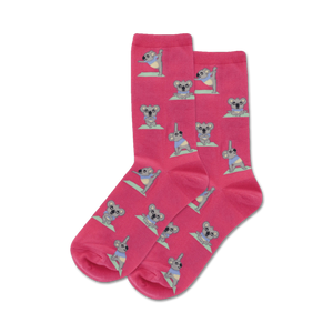 Pair of pink crew socks with a repeating pattern of koalas doing yoga. Koalas are gray and pastel colors.