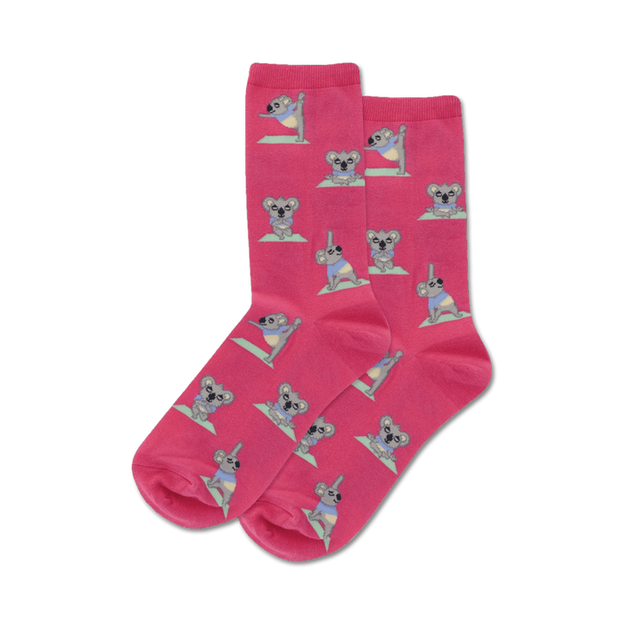 Pair of pink crew socks with a repeating pattern of koalas doing yoga. Koalas are gray and pastel colors.
