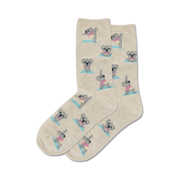 Close-up of beige crew socks featuring koalas practicing yoga.  The koalas have pastel accents.