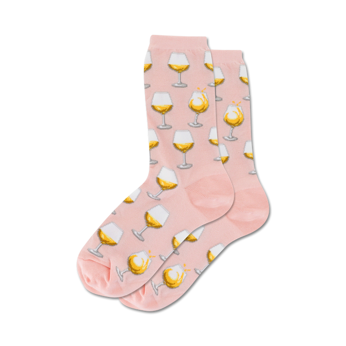 pink crew socks for women with a pattern of white wine glasses filled with a light yellow liquid and bubbles.  