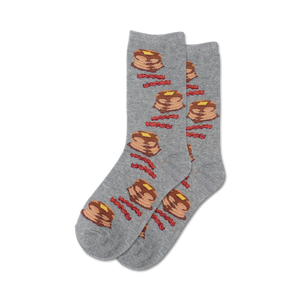 Lifestyle shot of a person's feet wearing grey Pancakes and Bacon socks.