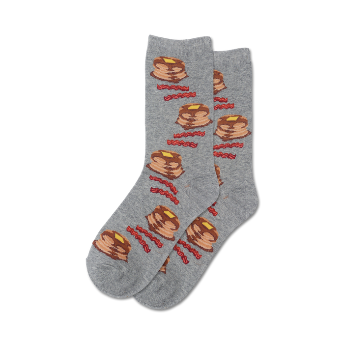 Lifestyle shot of a person's feet wearing grey Pancakes and Bacon socks.
