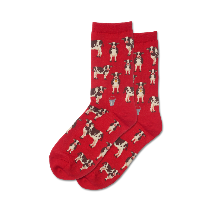 Pair of red crew socks with an all-over print of black and white cows and small metal pails. }}