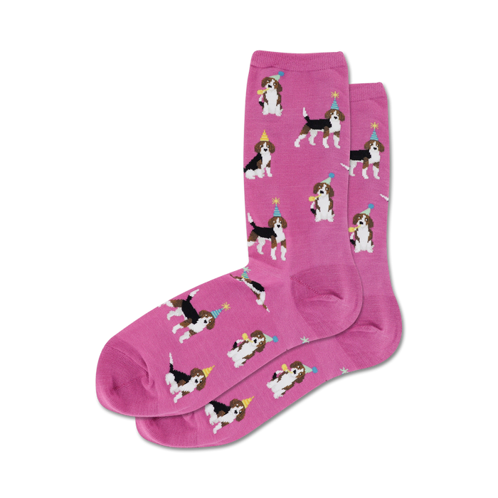 Pair of pink crew socks with a pattern of beagles wearing party hats.