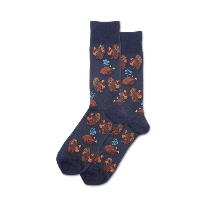 Pair of navy blue crew socks with a repeating pattern of brown turkeys and roasted turkeys with light blue steam details. }}