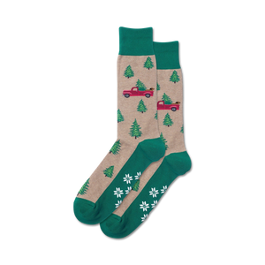 Close-up of a pair of tan and green Holiday Trucks Non-Skid Slipper socks.  The socks feature the same design as the main image, just in different colors.