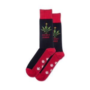 Pair of red and black crew socks. Design features a marijuana Christmas tree and the words Merry Juana.  White marijuana leaves on the red bottom.