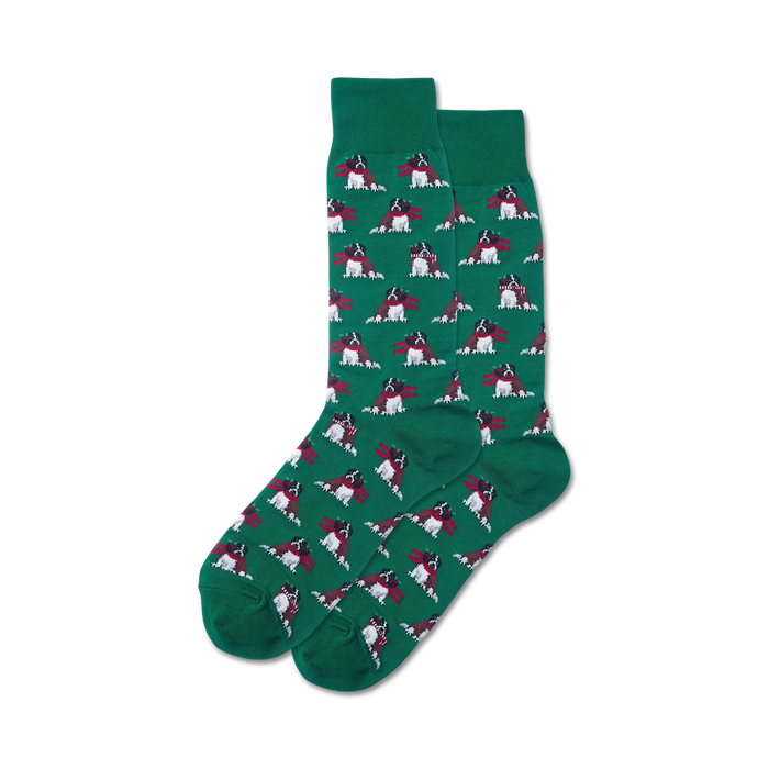 Pair of crew socks, green, featuring a repeating pattern of dogs wearing red scarves.