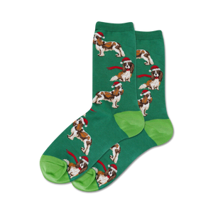 Close-up of a pair of green crew socks with the same Cavalier King Charles Spaniel design; lime green heel and toe.