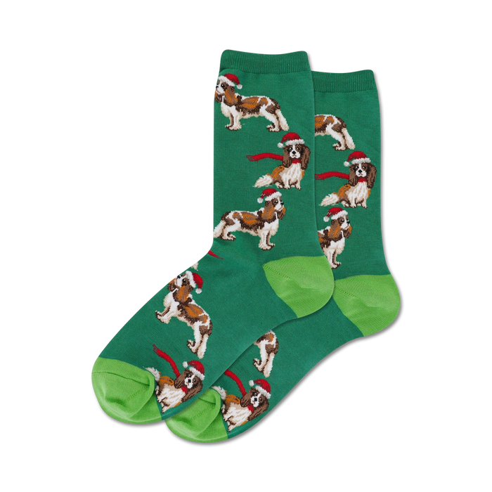 Close-up of a pair of green crew socks with the same Cavalier King Charles Spaniel design; lime green heel and toe.