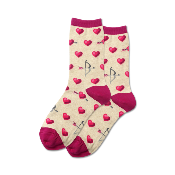 Lifestyle shot of Bow and Arrow socks in beige with fuchsia cuffs, showing the socks being worn.