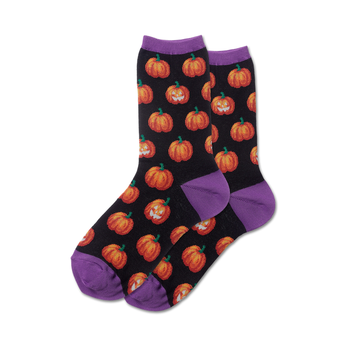 Pair of black crew socks with orange pumpkins and purple cuffs.  Pumpkins glow in the dark! }}