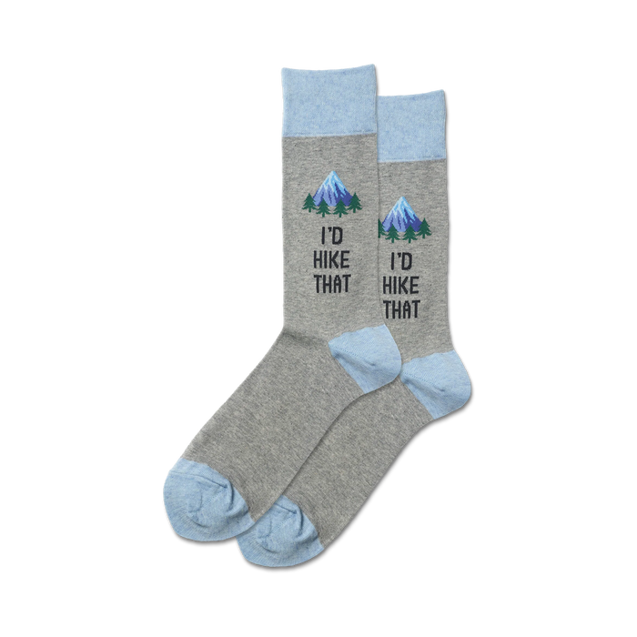 Pair of grey crew socks with a light blue cuff. A small mountain scene and the text 'I'd Hike That' are embroidered on the socks. }}