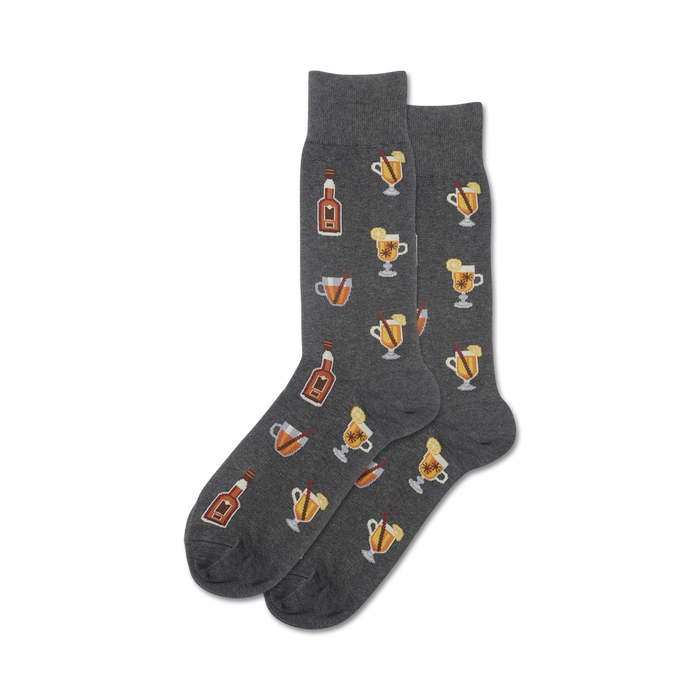 mens gray crew socks with pattern of brown bottles, orange slices, white flowers, and yellow blooms. whiskey themed.    }}