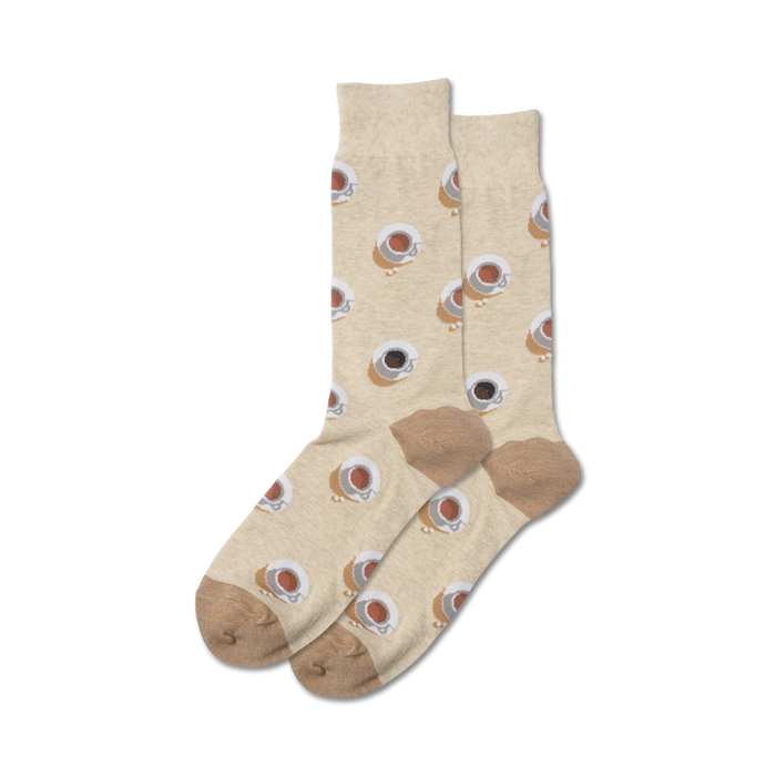 Pair of beige crew socks with a repeating pattern of brown coffee cups. The socks have a taupe heel and toe. }}