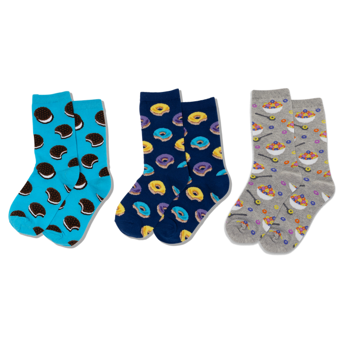 Three pairs of crew socks: light blue with sandwich cookies, navy with yellow and purple donuts, and grey with cereal bowls. }}