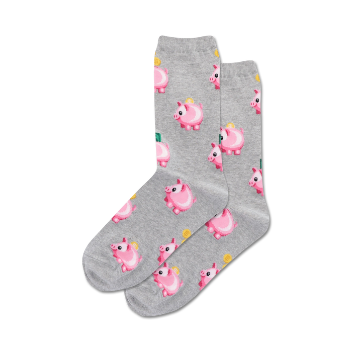 Pair of crew socks, grey and black color options, featuring a repeating pattern of pink piggy banks with coins.