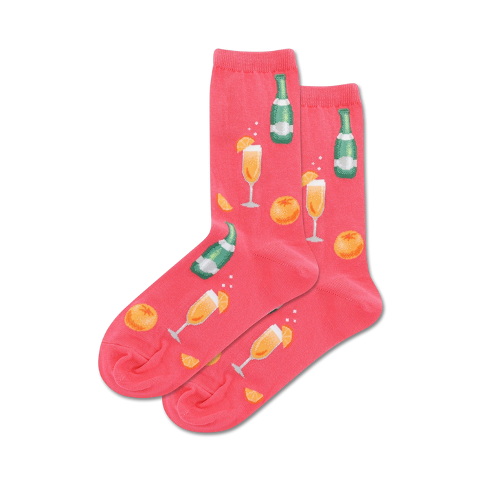 Lifestyle shot of the coral Mimosa socks on a model's feet.