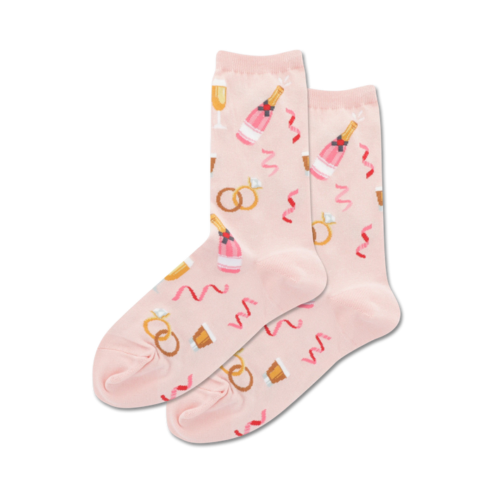 Pair of women's crew socks in pink and light blue. Features champagne bottles, wedding rings, and confetti.