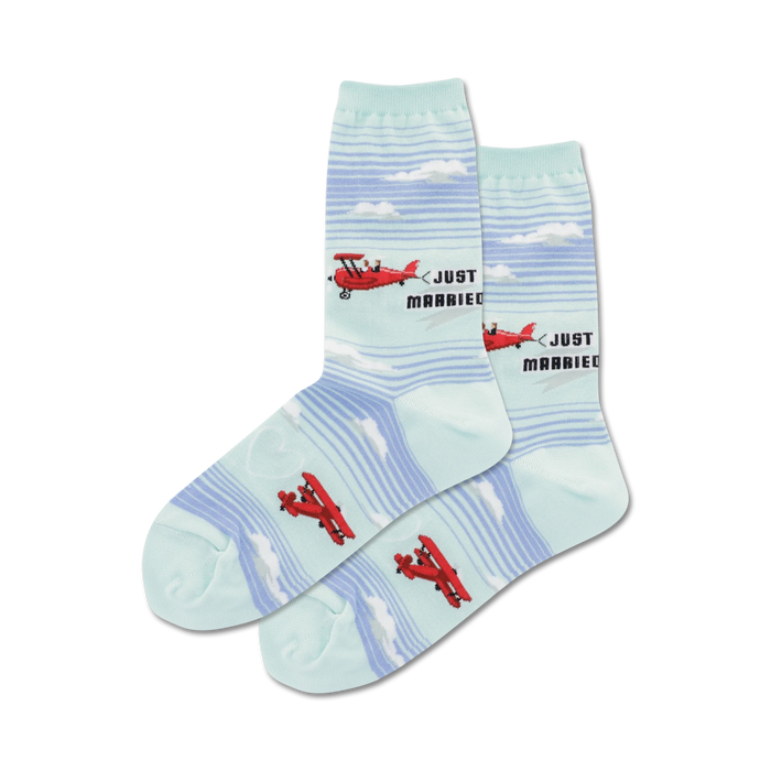 Pair of crew socks in light blue and white. Design features red airplanes and 'Just Married' text. }}