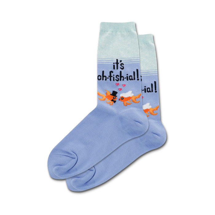 Pair of light blue crew socks featuring two goldfish kissing, text 'It's Oh-fish-ial!', and small hearts. }}
