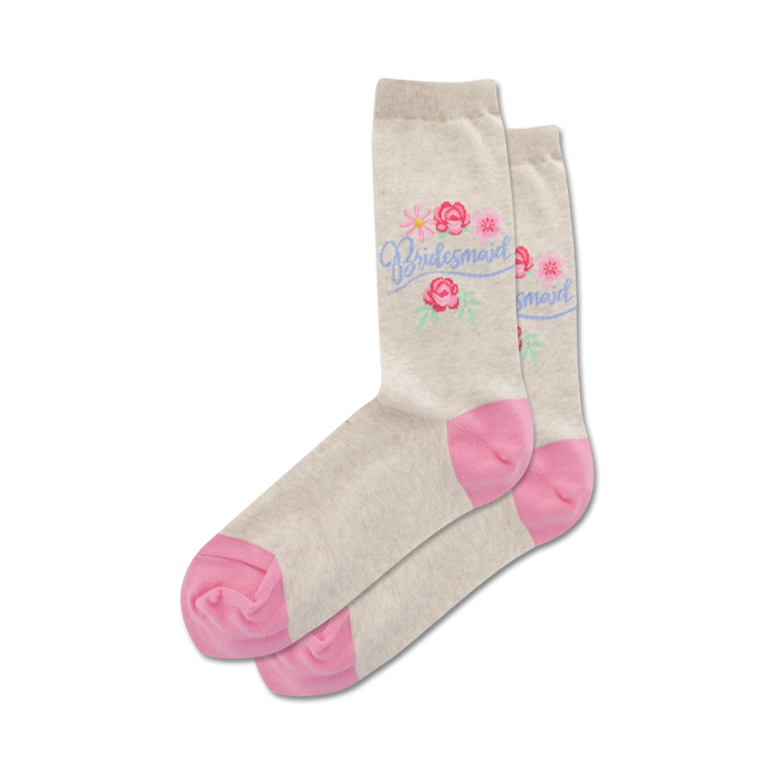 Pair of beige crew socks with pink heels and toes.  Features a lavender 'Bridesmaid' script and small floral design. }}