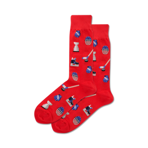 Pair of red crew socks with a hockey-themed pattern. The pattern includes hockey sticks, pucks, goalie masks, and skates in blue.