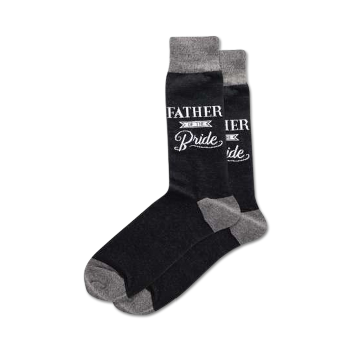 Pair of dark gray crew socks with a white 'Father of the Bride' design.  Features a gray cuff. }}