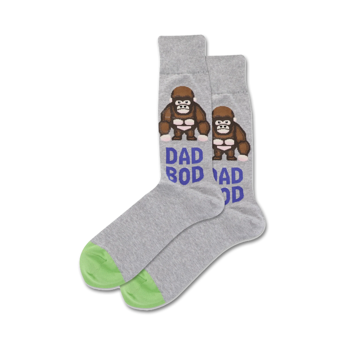 mens gray crew socks with green toes and heels have dad bod words and brown gorilla with beer belly pattern.     }}